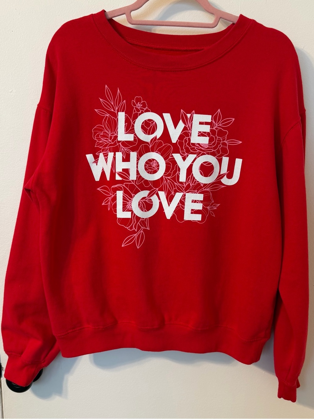 Wound Up Red Crewneck Sweatshirt with "LOVE WHO YOU LOVE" Graphic